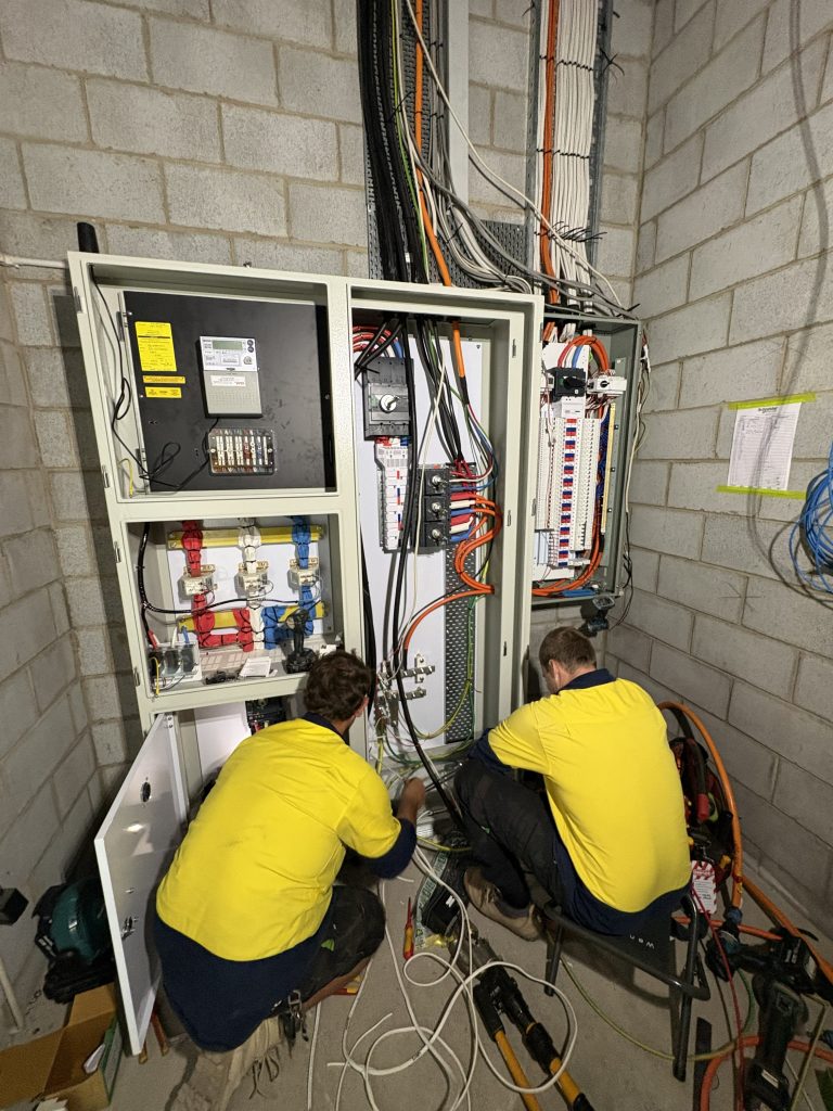 ECQ electrician at work on a Brisbane project